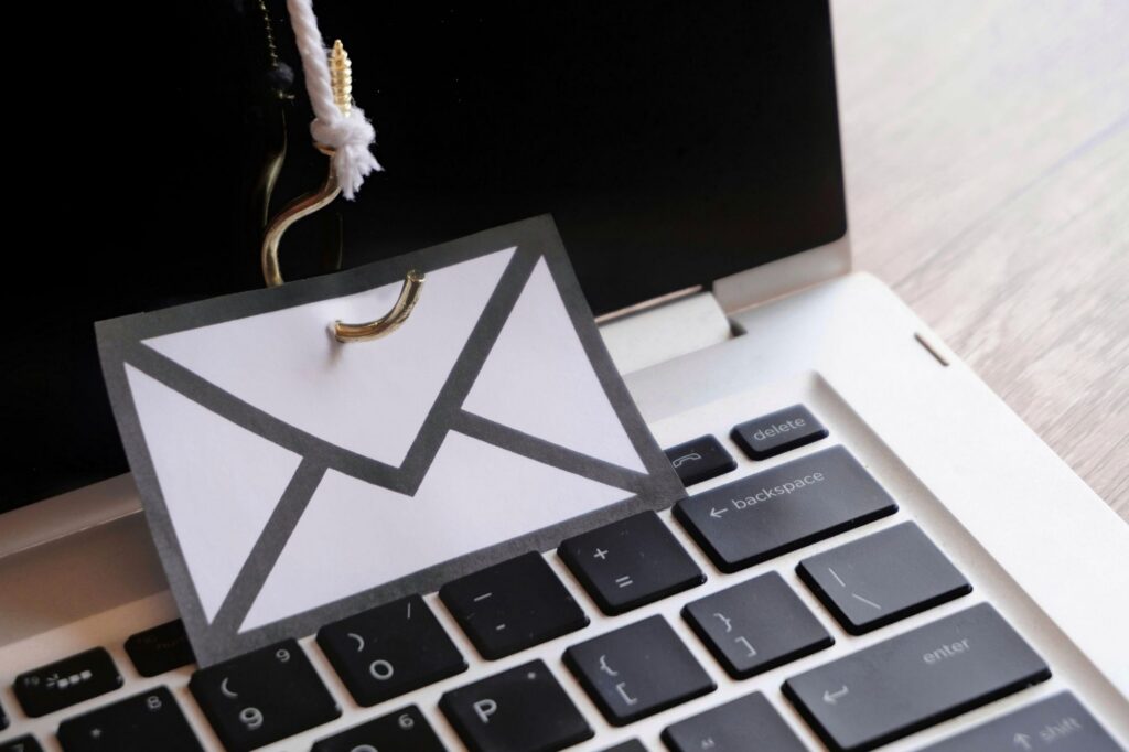 hook attached to an email icon depicting phishing