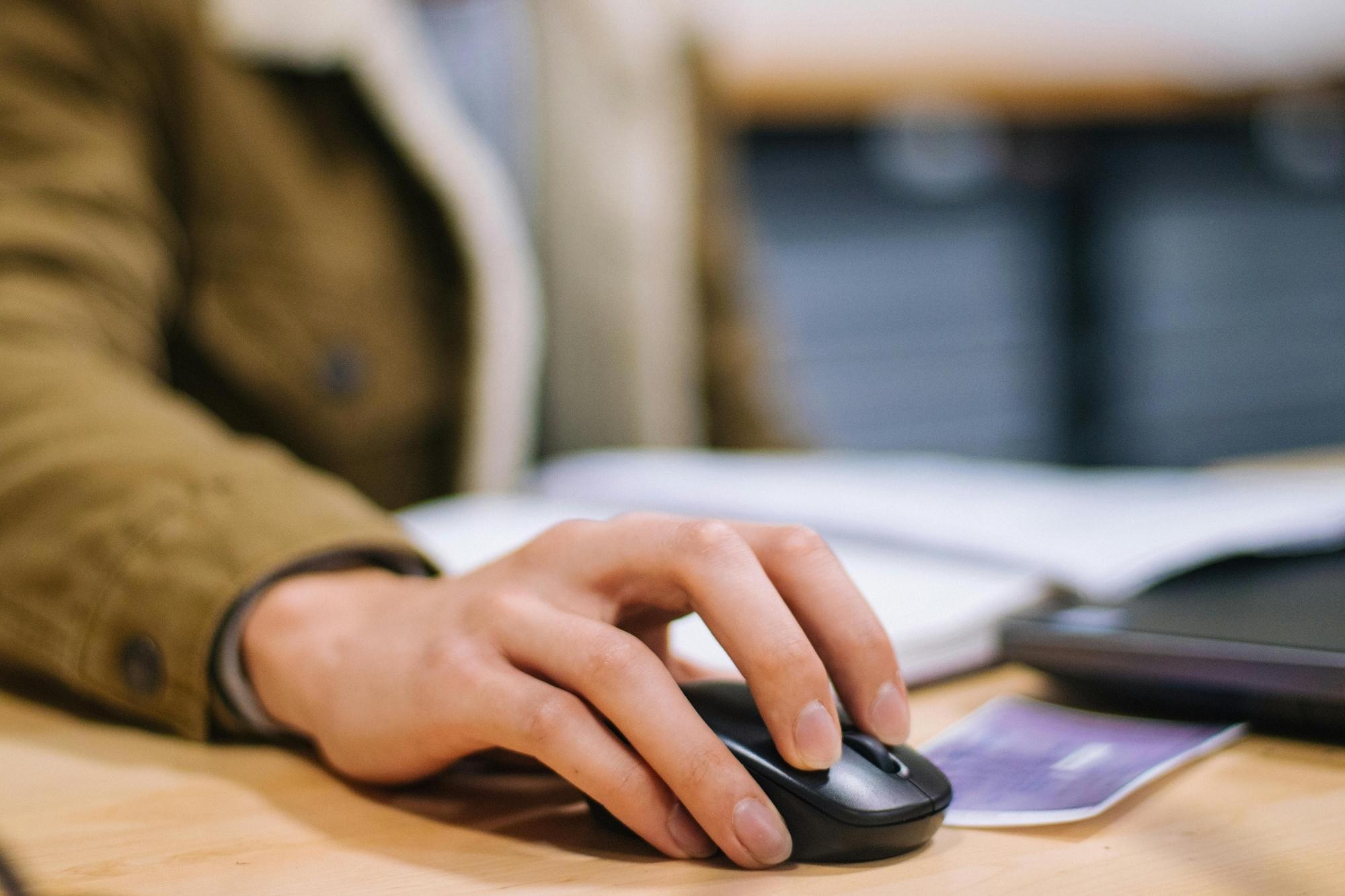 man using a computer mouse