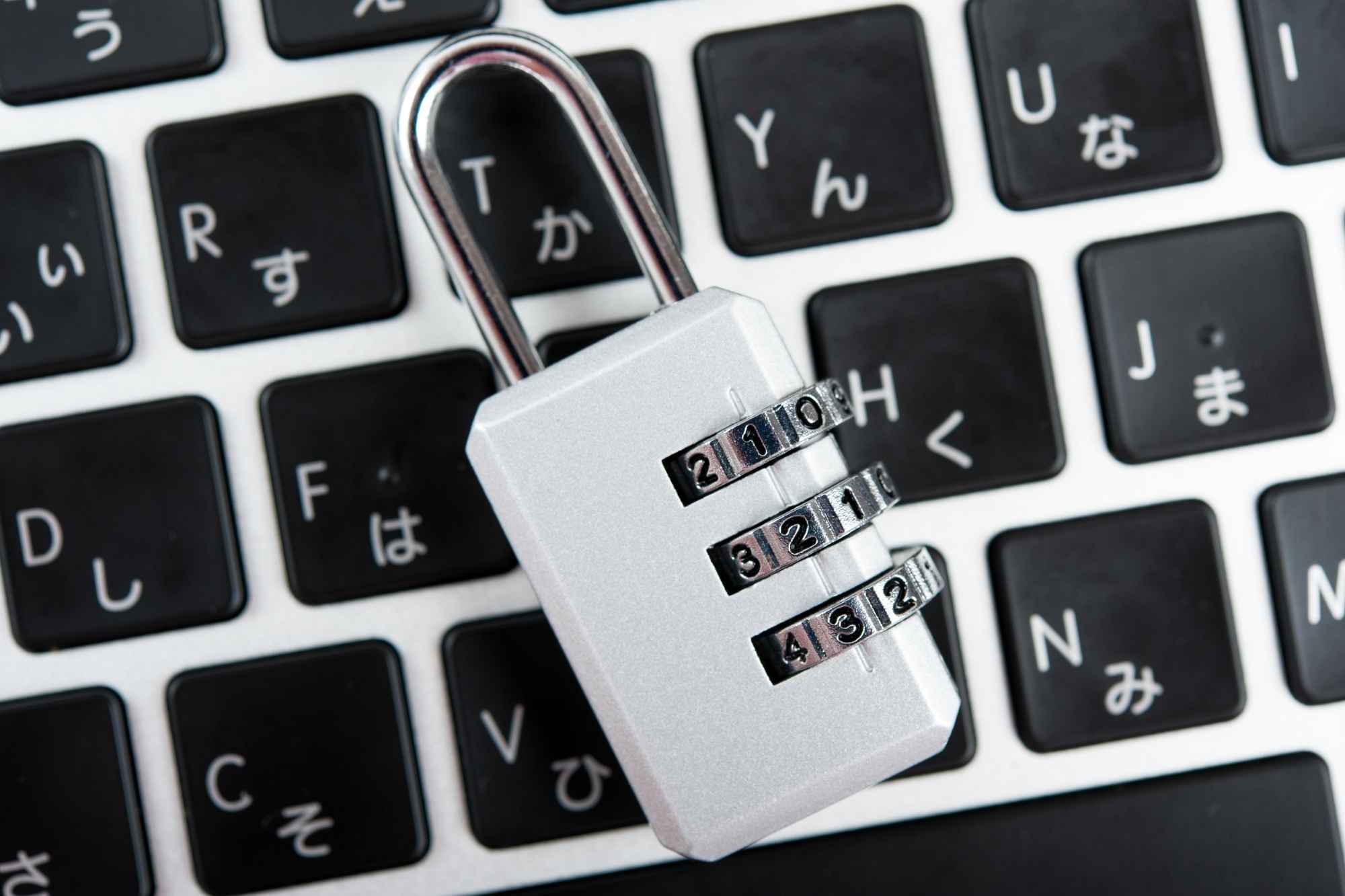 white lock on top of laptop