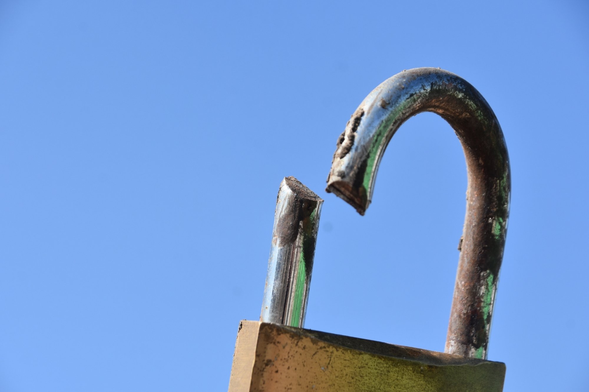broken lock in blue background