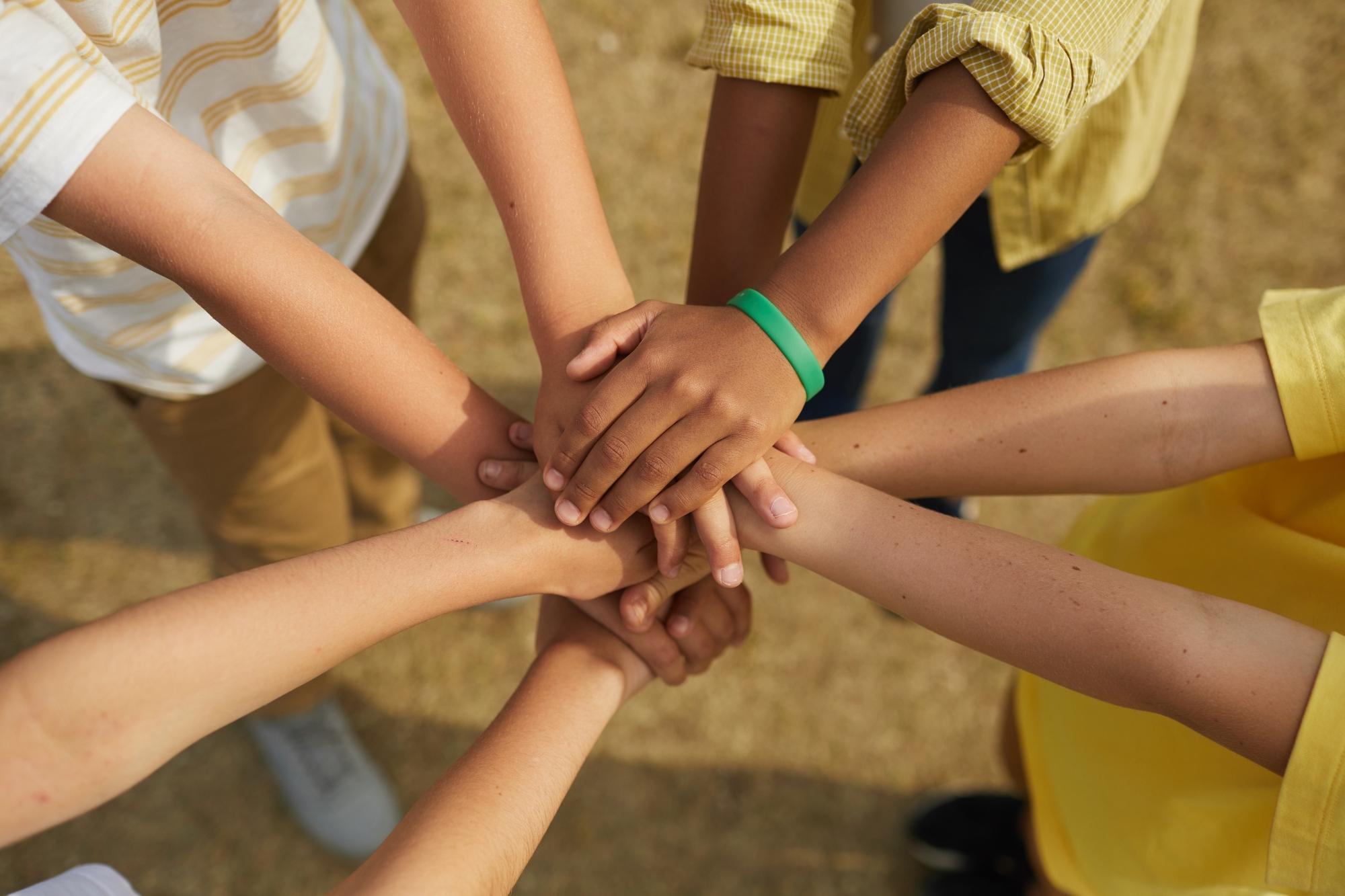 group of people holding hands