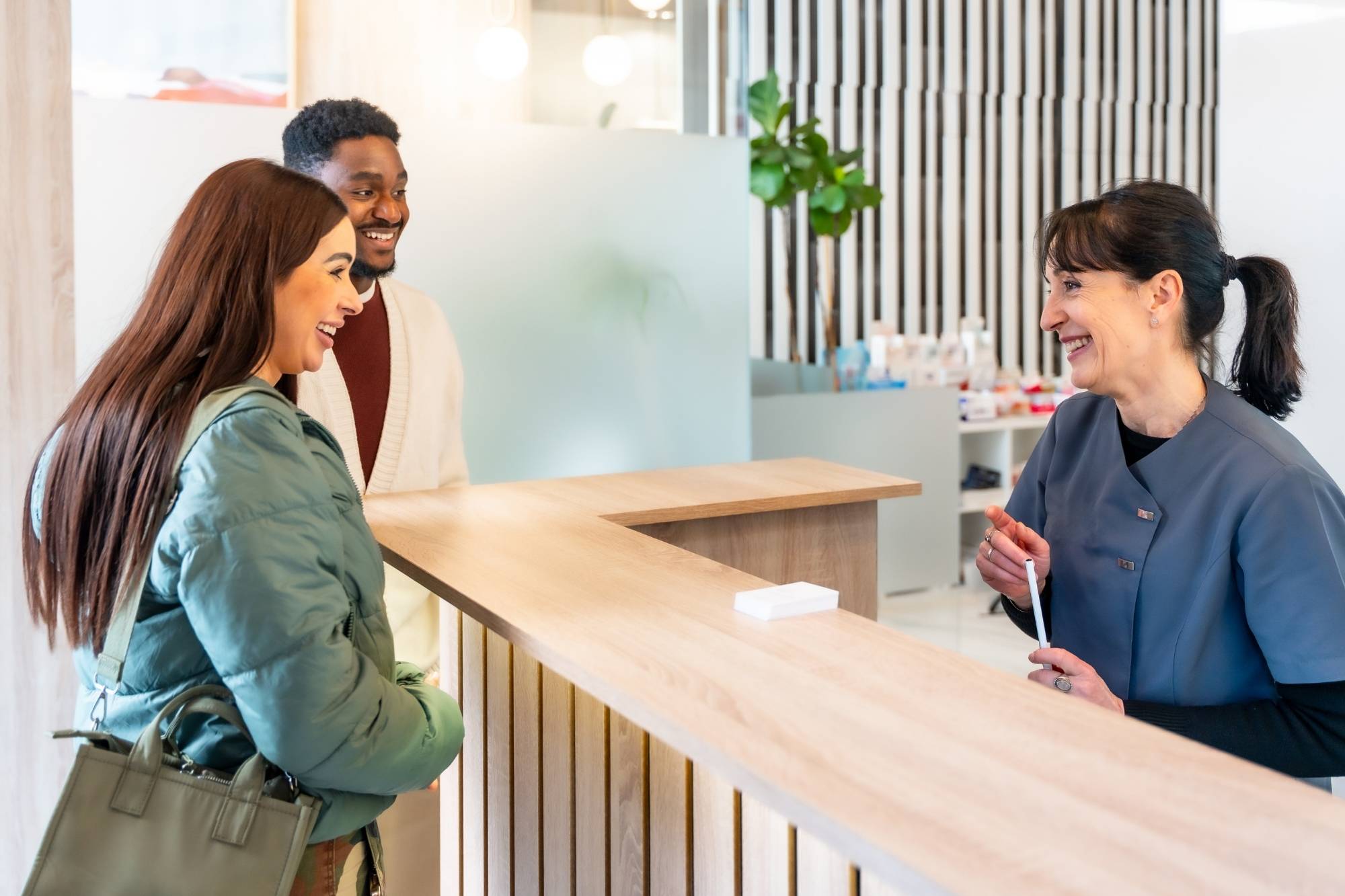 medical receptionist talking to a patient
