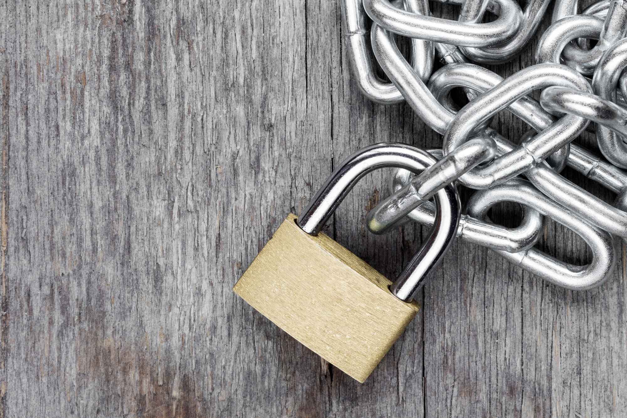 chains tied to a gold lock