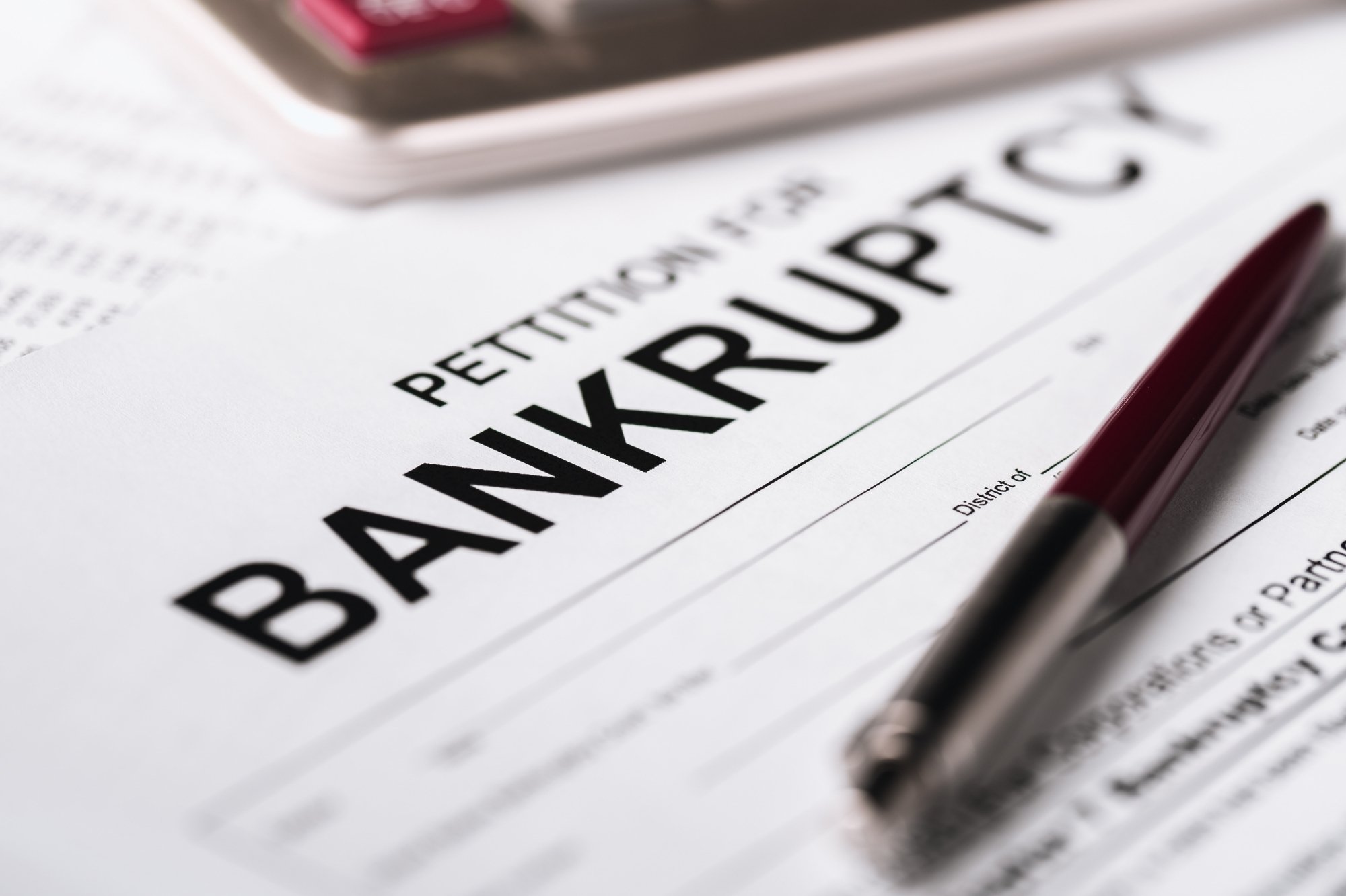 pen on top of bankruptcy papers