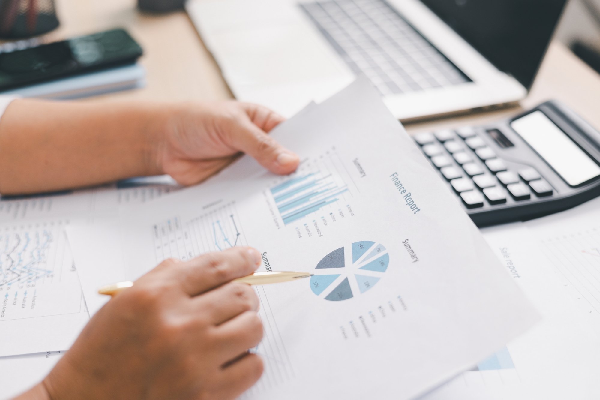 analyzing a financial report in a desk