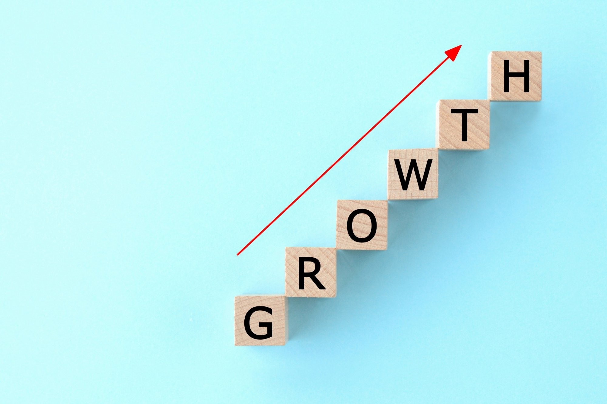 growth word written in wooden boxes
