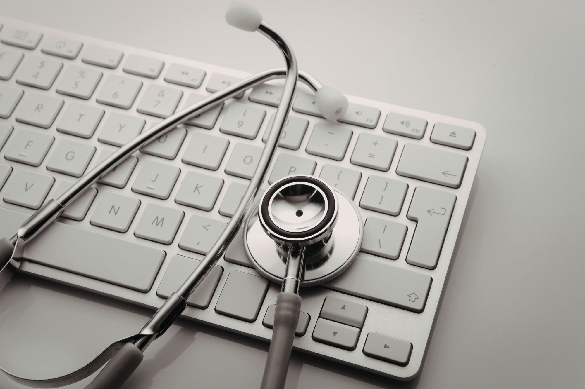 stethoscope on top of keyboard