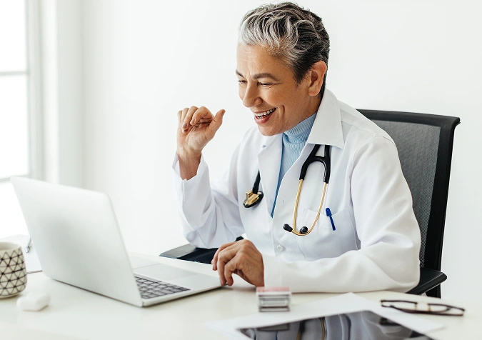 A doctor using a laptop