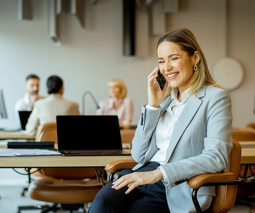 Businesswoman talking on the phone in a modern office
