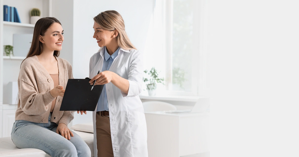 Doctor discussing information with a patient using a clipboard