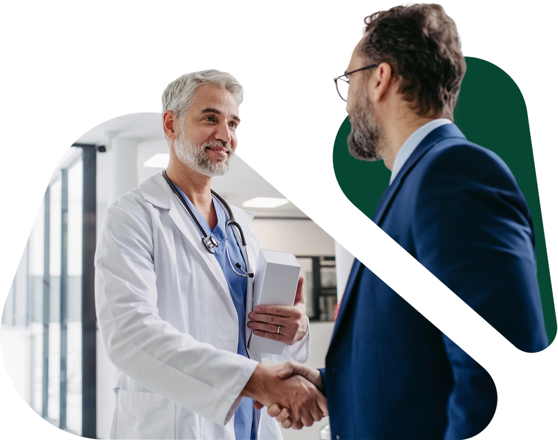 Doctor shaking hands with a patient in a business suit