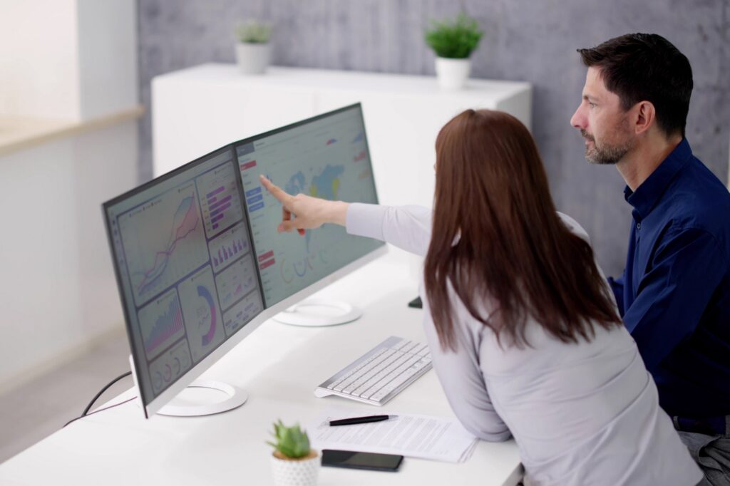 doctor and tech support discussing data migration