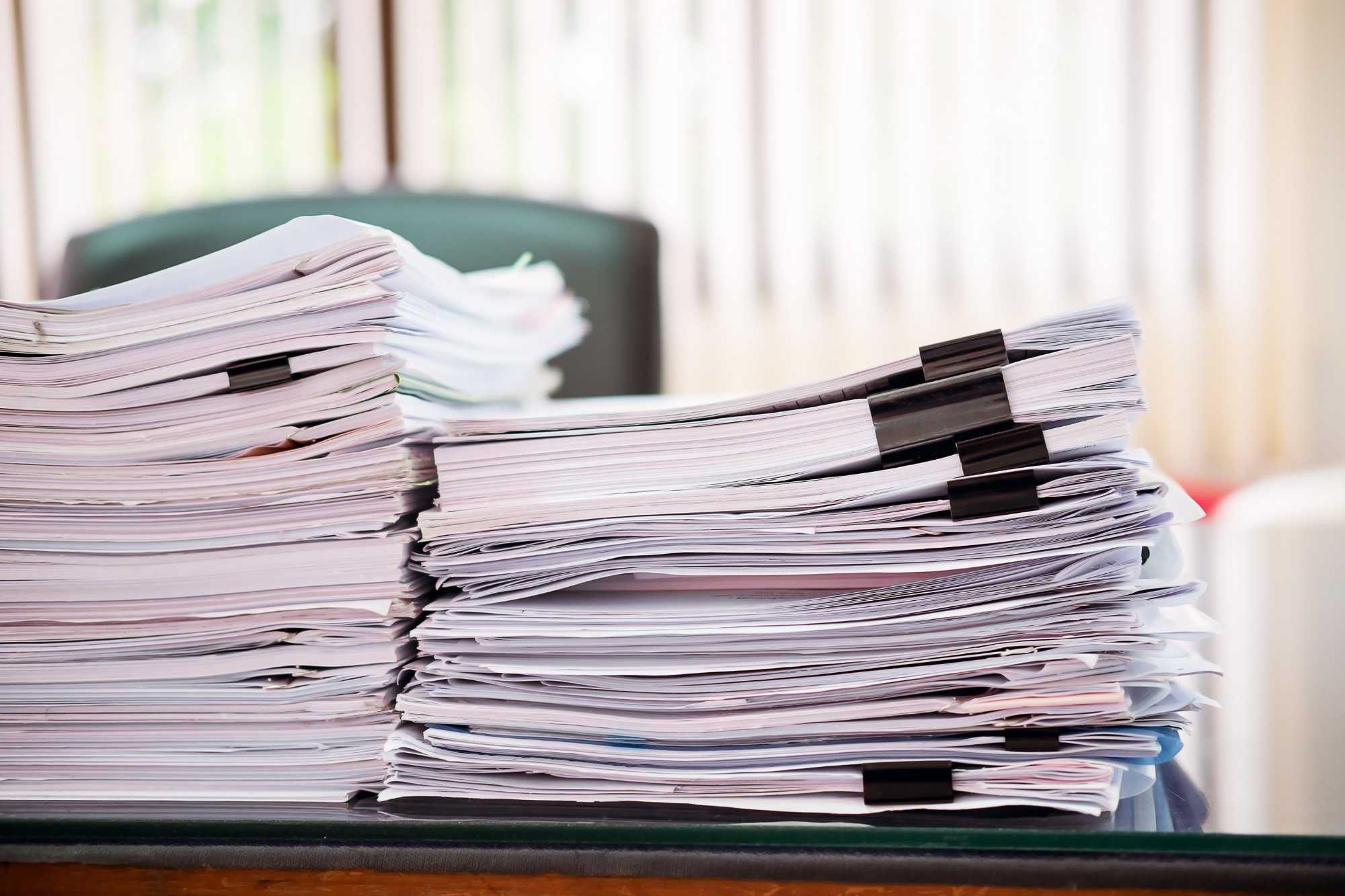 pile of documents in a table
