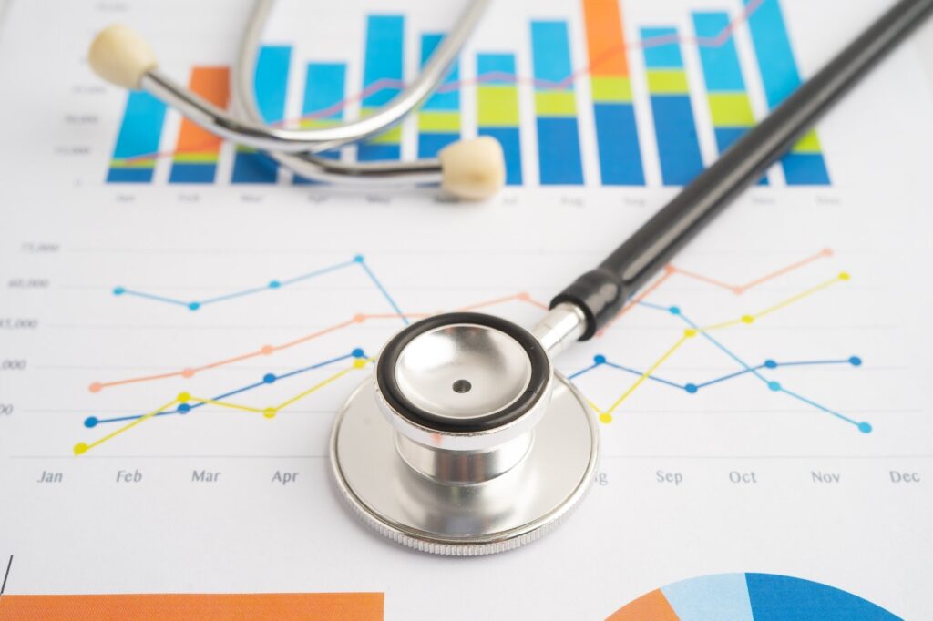 stethoscope on top of health charts