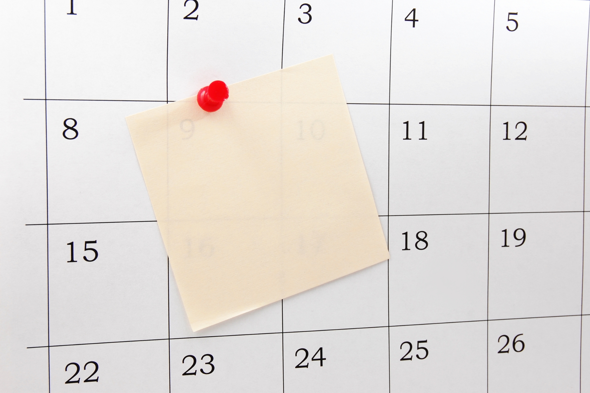 calendar with sticky notes pinned to it