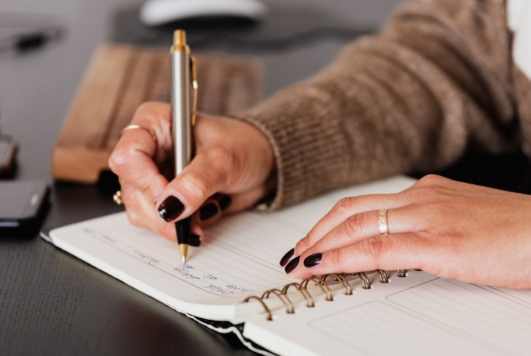 writing notes in a notebook