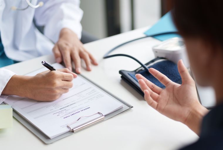 doctor writing patient information