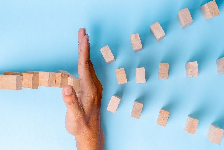 stopping wooden dominos from falling