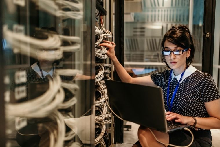 woman updating a clinic data server