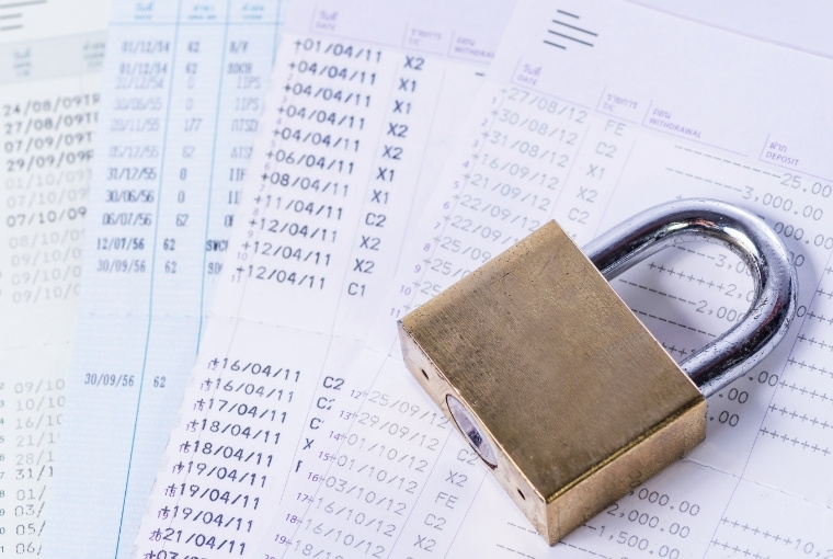lock on top of several documents
